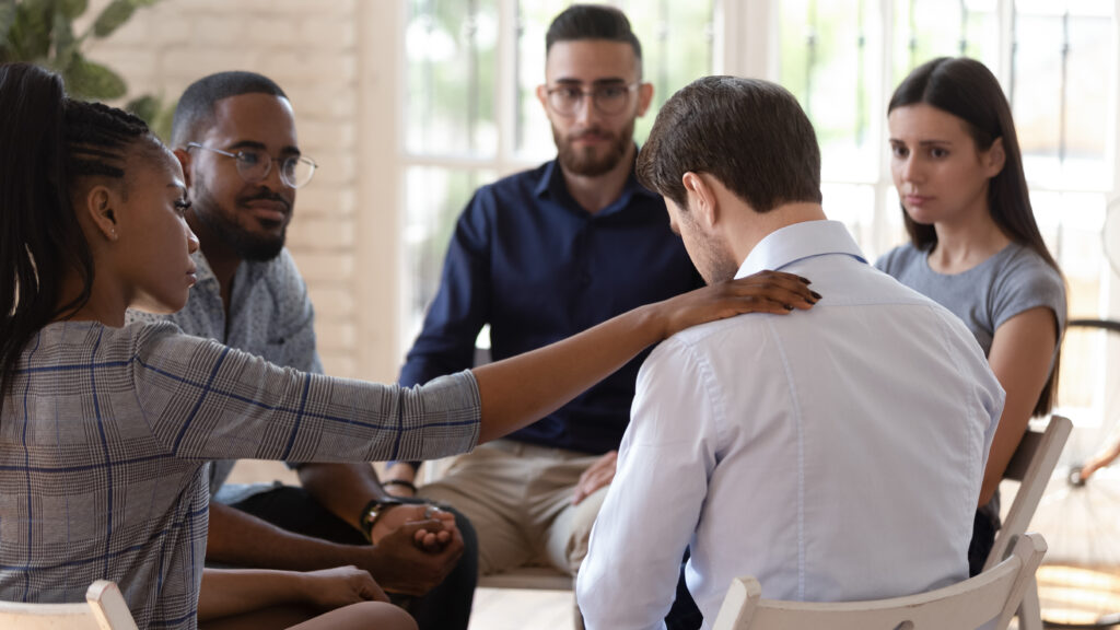 Man receiving support during support group for loved ones with heroin addition in Park City, UT