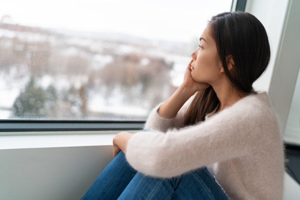 A woman looking out a window