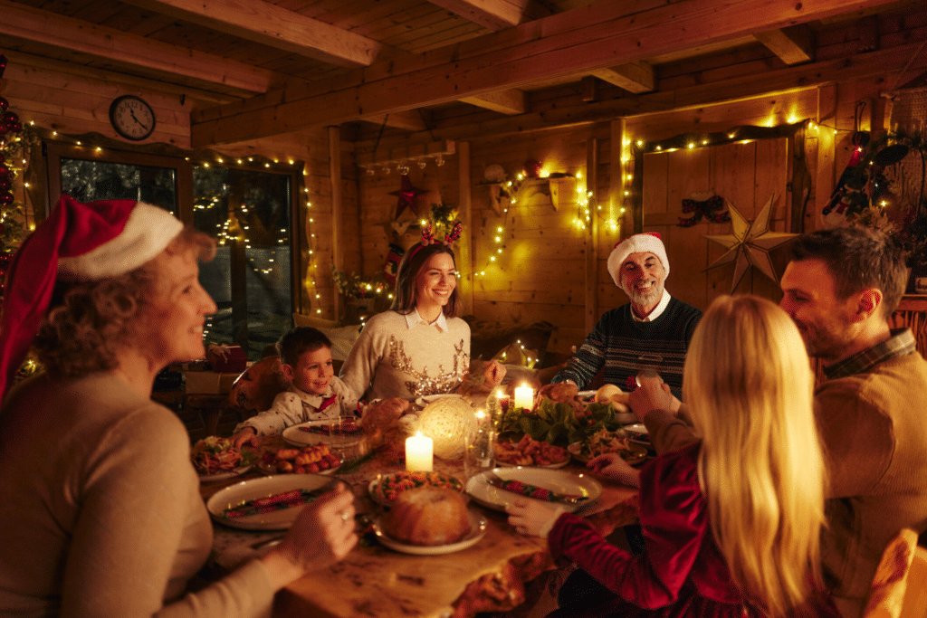 Family gathered around a holiday table, showing love and support to encourage a loved one on their recovery journey