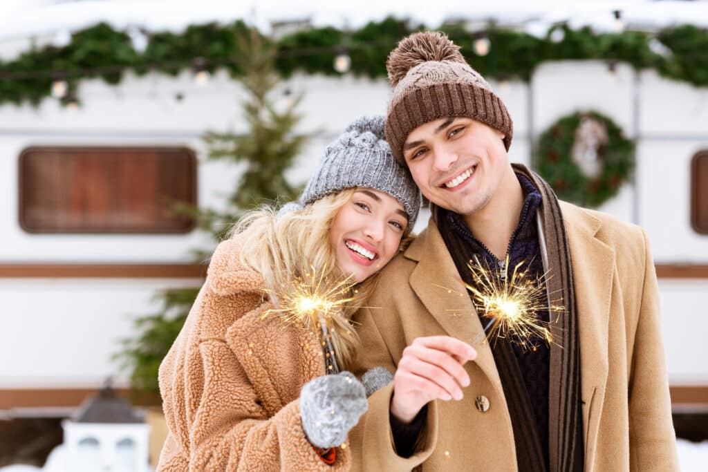 Sober couple holding sparklers celebrating the new year without triggers