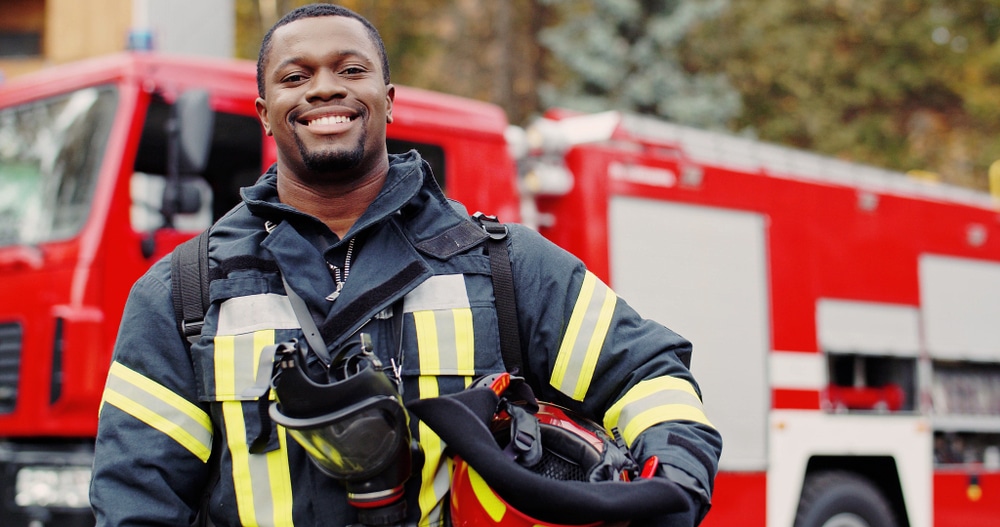 A firefighter smiling